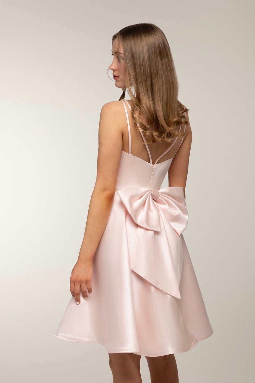 Beautiful pink satin party dress with a bow from Zazabella